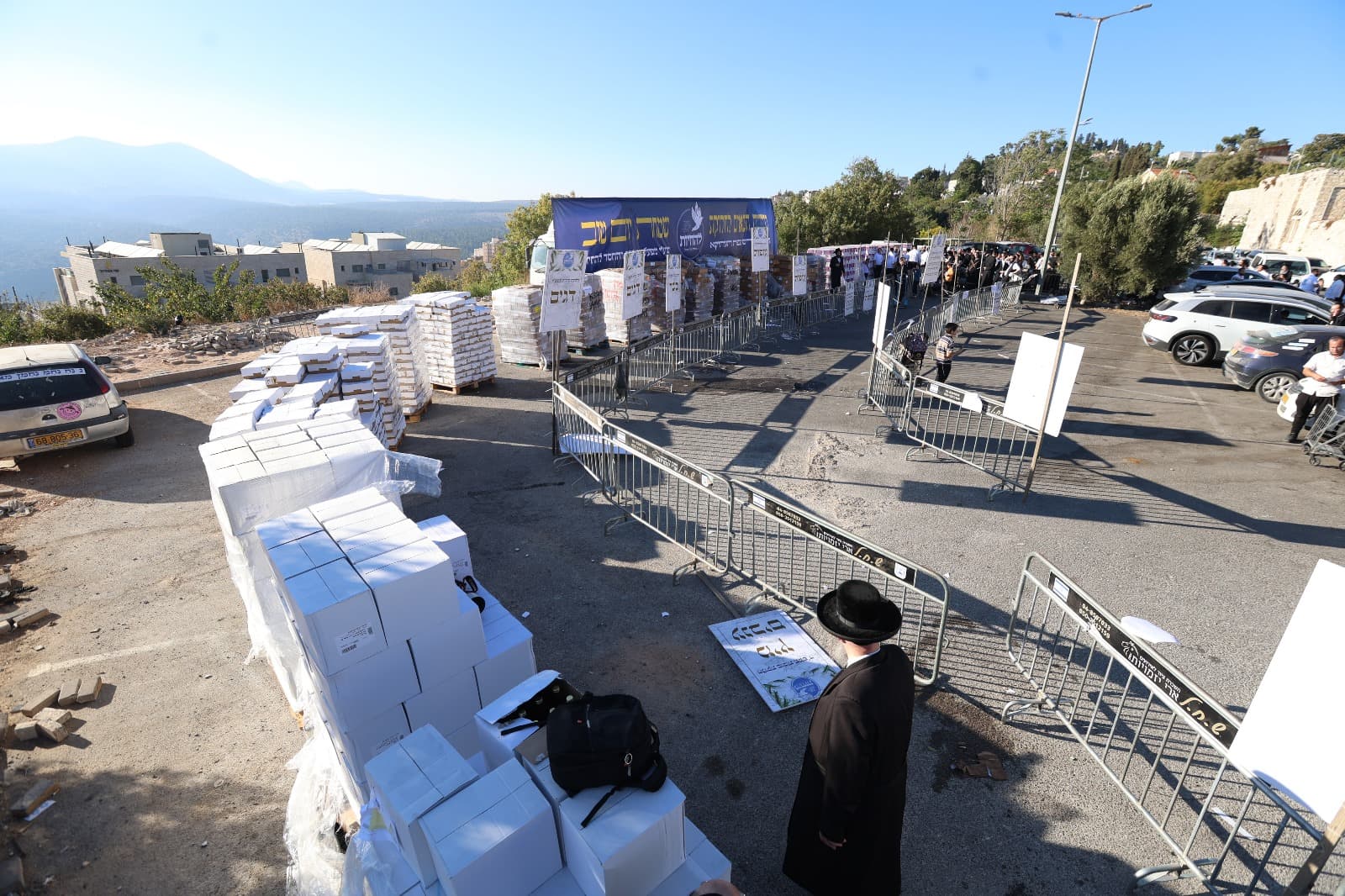 Volunteers loading Yom Tov packages for distribution in Tzfat